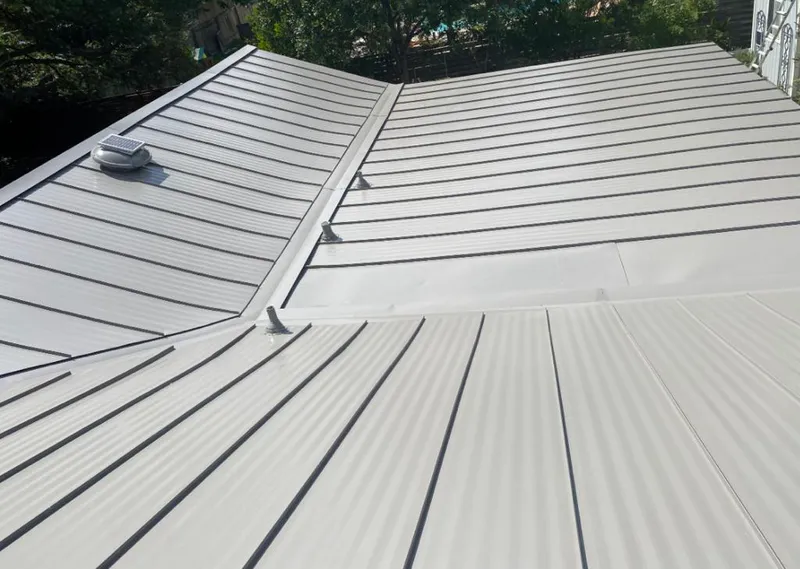 Solar attic fan installed on a metal roof for Roof Ventilation in Knoxville